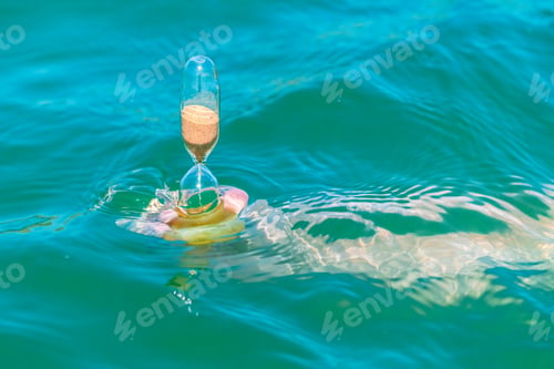 Preview: Sand running through an old hourglass measuring passing time and counting down to a deadline