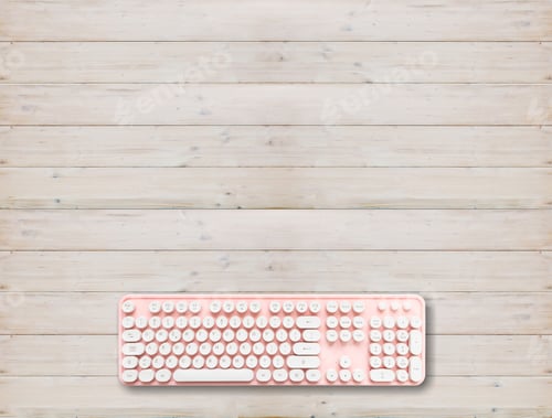 Preview: Computer keyboard pink color on wood background,