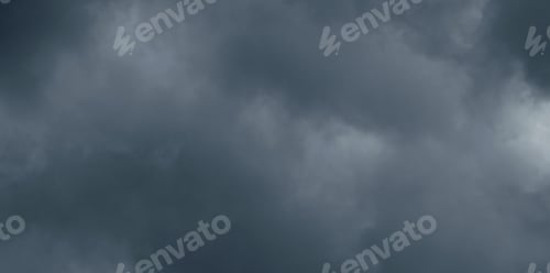 Preview: Dark storm sky with dramatic fluffy clouds. Cloudscape rainy season.