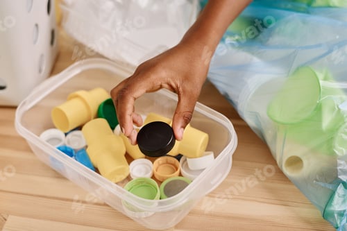 Preview: Boy separating lids from garbage