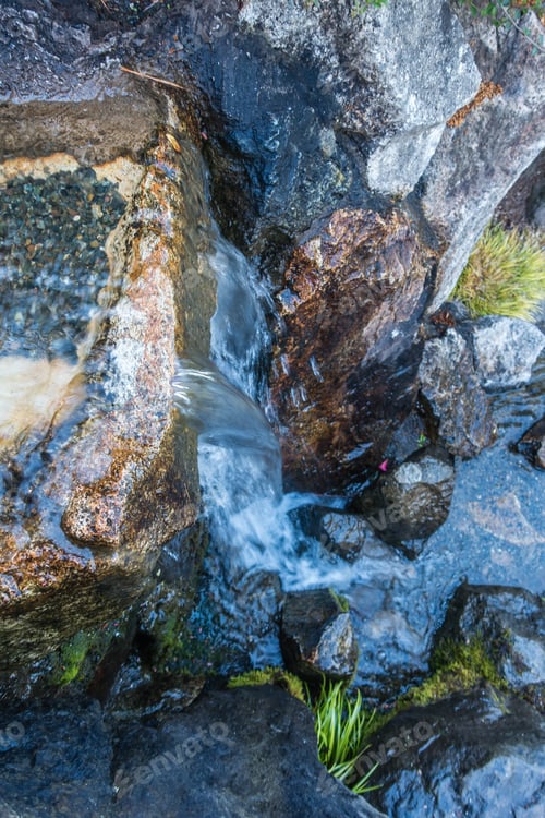 Preview: Closeup Shot Of Water Flowing Over Rocks.