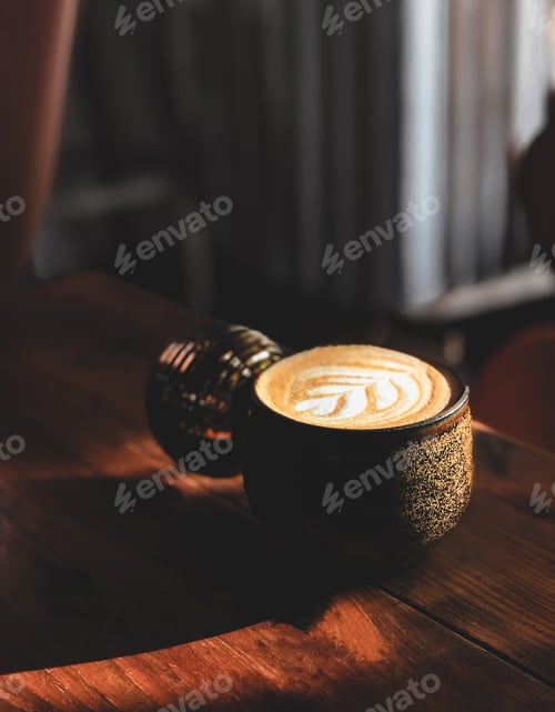 Preview: Hot art Latte Coffee in a cup on wooden table