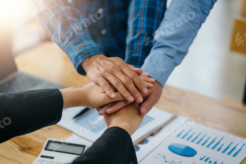 Preview: Business people put their hands together as a contract to do business together work together as a te