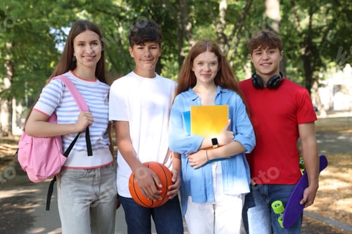 Preview: Group of teenagers walking together in park