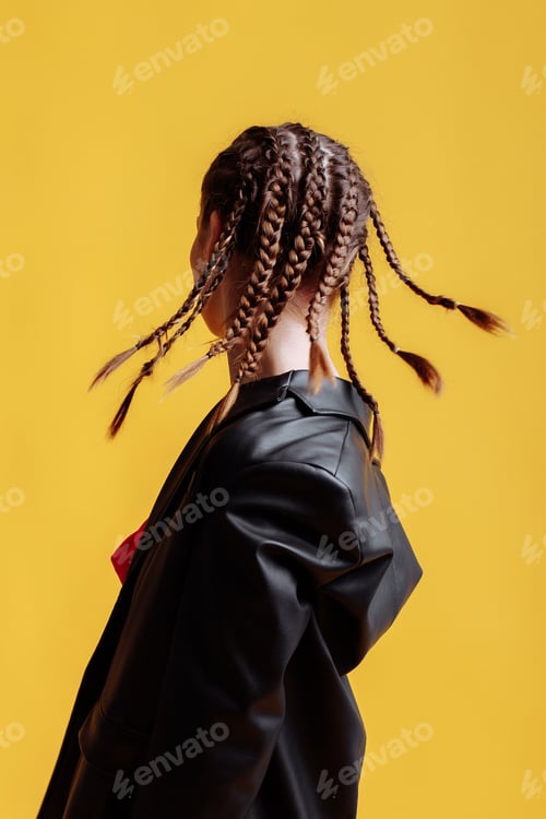 Preview: Beautiful female model in a red dress yellow background