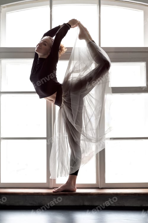 Preview: Woman practicing yoga, doing Natarajasana exercise, Lord of the Dance pose