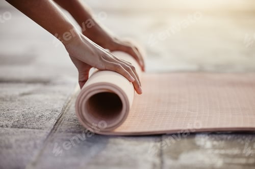 Preview: Macro of yoga, floor and woman hands with mat after exercise in gym, home or patio. Girl roll up ge