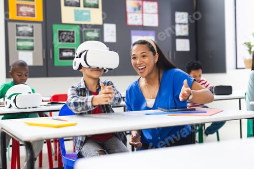 Preview: In school, diverse group of students and their teacher exploring virtual reality