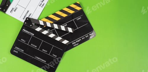 Preview: Three clapper boards or movie slate on the green screen background floor.