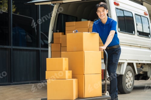 Preview: Asian delivery man work in truck for checking the product in the truck, concept ecommerce.