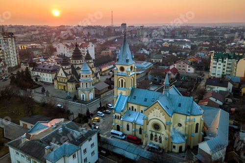 Preview: Aerial view of city at dawn or dusk. Urban landscape with church domes, parked cars, high buildings