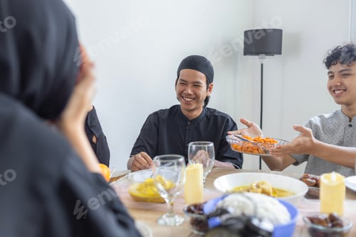 Preview: Happy Indonesian Family Sharing Traditional Meal And Serving Each Other During Eid