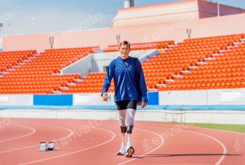 Preview: Sport man athlete prosthesis legs carry the bag and walk on the track of the stadium with day light