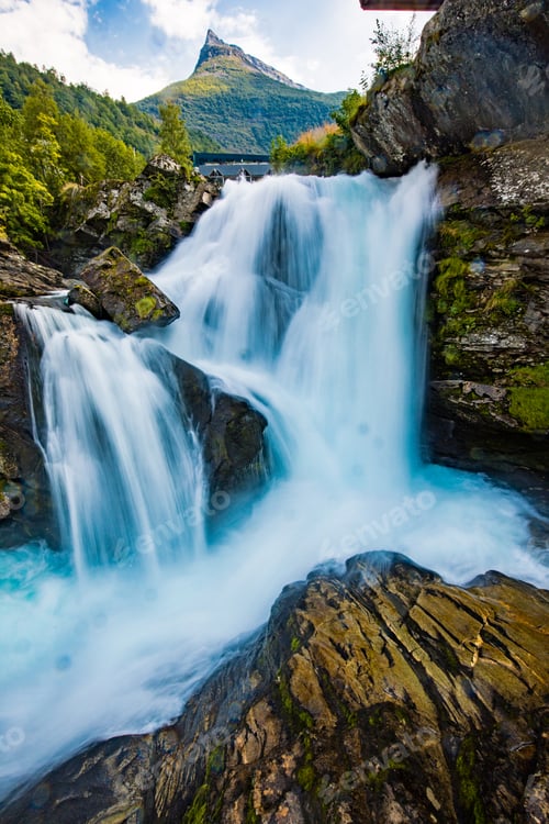 Preview: View of the river Geirangerelvi and the waterfall Storfossen in Geiranger, Norway.
