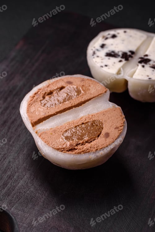 Preview: Delicious sweet mochi dessert with toppings on a dark concrete background