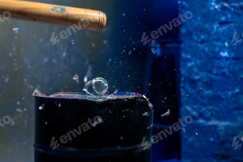 Preview: close up of a baseball bat smashing a glass in a destroy room for stress relief glass flies
