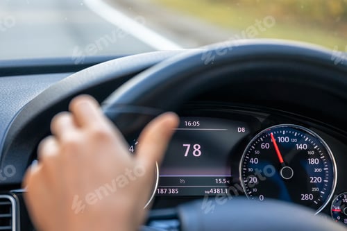 Preview: Steering wheel in a car close up, high speed driving on the road.