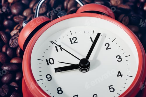 Preview: Red alarm clock lying on coffee beans. S Concept of morning awakening, beginning of working day