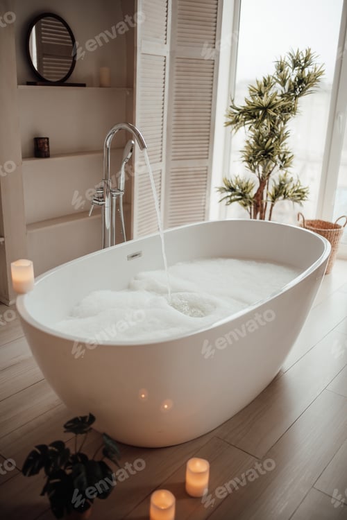 Preview: Luxury interior of big bathroom at modern african style with oval bathtub in natural lighting