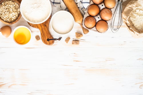 Preview: Baking ingredients at white wooden table