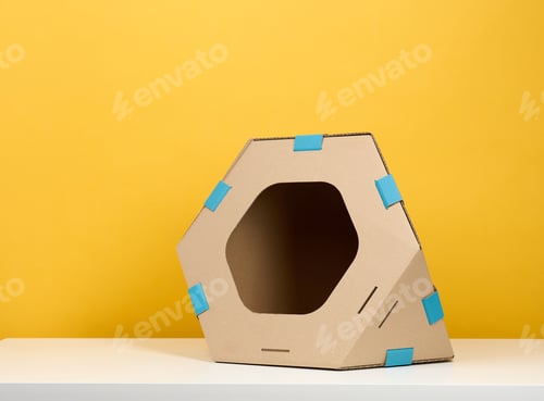 Preview: Brown cardboard modular house with a hole for cats and animals on a yellow background