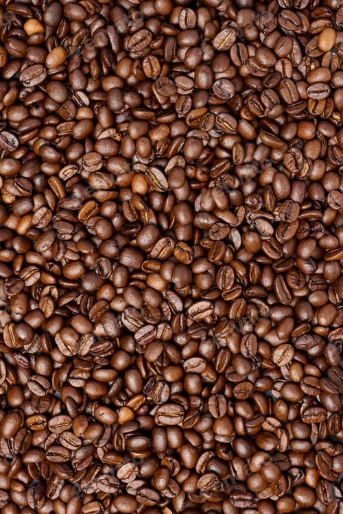 Preview: Scattered roasted coffee beans, full frame