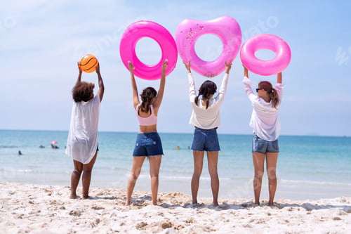 Preview: Teenage girl friendship enjoy laughing play on the blue sky sea and run to get water inflation toy