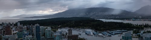 Preview: Aerial view of Downtown City during a stormy summer sunset