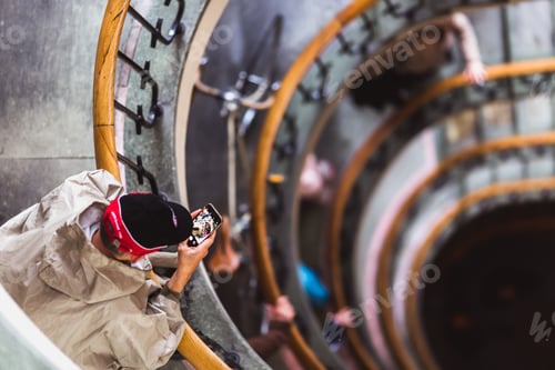 Preview: People take photo old spiral staircase, spiral stairway inside an old house in Budapest, Hungary