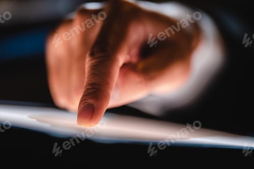 Preview: Hand or finger pointing or touching a mobile phone or tablet screen, concept of social media