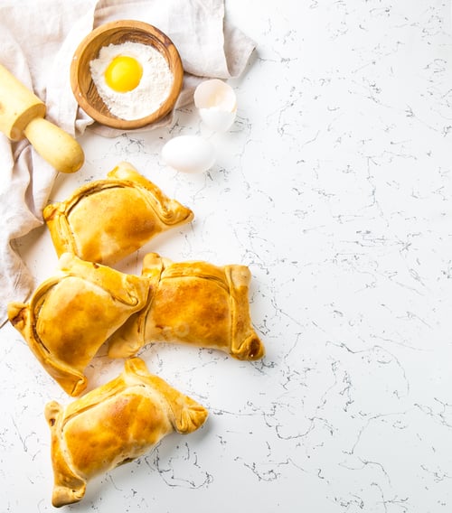 Preview: Chilean empanadas de pino. Empanadas on white background.