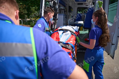 Preview: Paramedics transport the patient on a special stretcher to ambulance