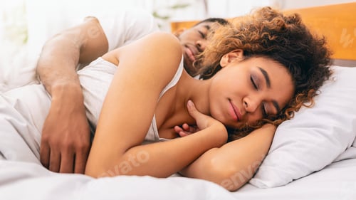 Preview: Loving couple sleeping in bed and hugging