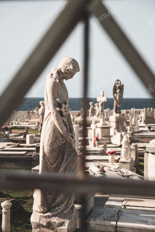 Preview: Vertical shot of the statues of women in the old San Juan cemetery, Puerto Rico
