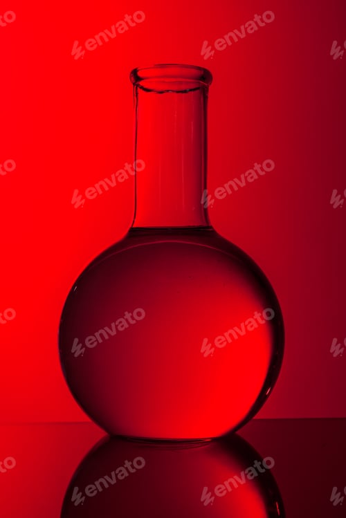 Preview: Science concept. Glass test tubes on red background