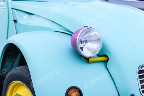 Preview: Close-up photo of headlight on a vintage car.