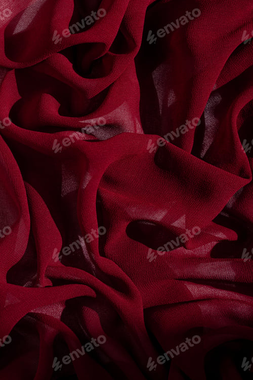 Preview: Smooth elegant burgundy chiffon fabric background. Dark red wine silk luxury cloth texture design
