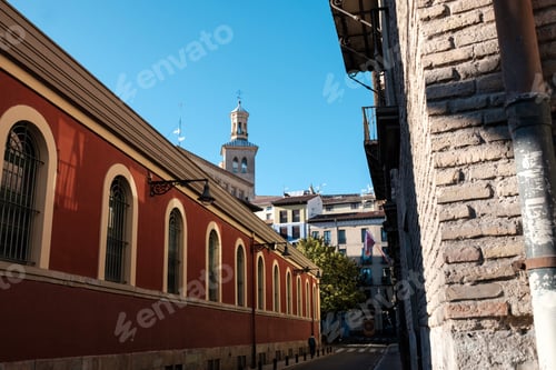 Preview: Red narrow street in old city in Spain.
