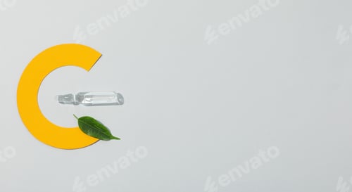 Vista previa: Vitamin C biosupplement in ampoules on a light background.