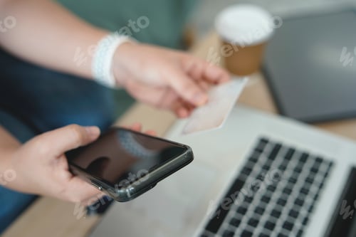 Preview: Women using laptop working and drinking coffee cup hot