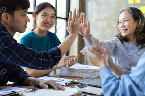 Preview: Group colleague high five office encourage working together to motivation them for successful work.