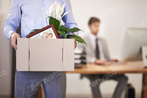 Preview: Cropped shot of a businessman leaving work as hes being replaced by a new employee