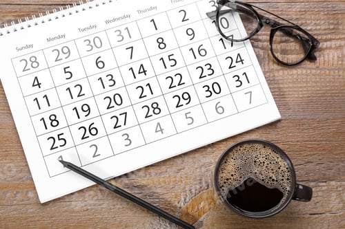 Preview: Flat lay composition with calendar and cup of coffee on wooden table