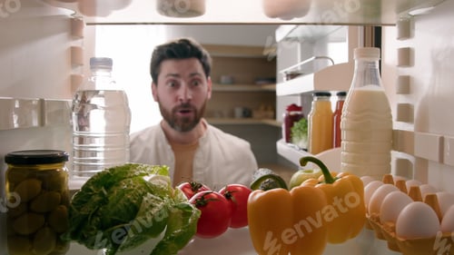 Preview: POV point of view from inside refrigerator Caucasian happy funny man adult excited surprised male