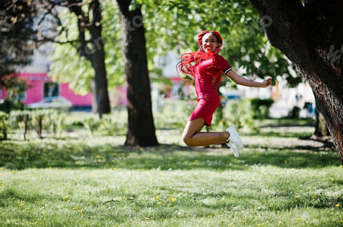 Preview: African american girl in red dress with dreadlocks