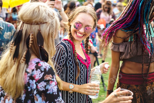 Preview: Group of Friends Drinking Beers Enjoying Music Festival together