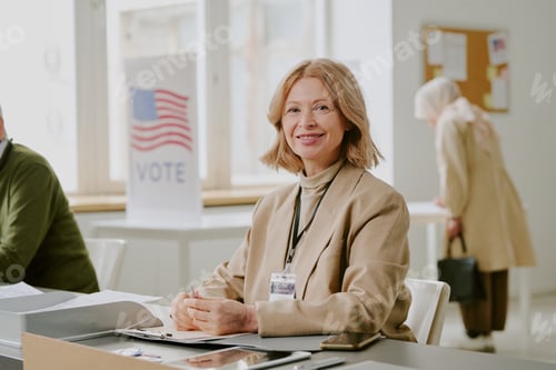 Preview: Cheerful Senior Woman At Work At Polling Station