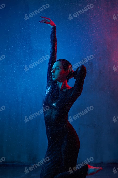 Preview: Sexy wet woman posing under rain.