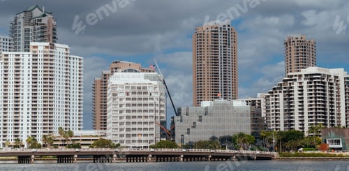 Preview: Scenic view of a bustling city skyline featuring a cluster of tall, modern skyscrapers