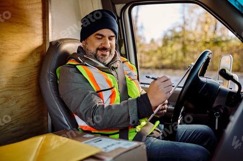 Preview: Delivery Man Taking Notes Inside the Truck